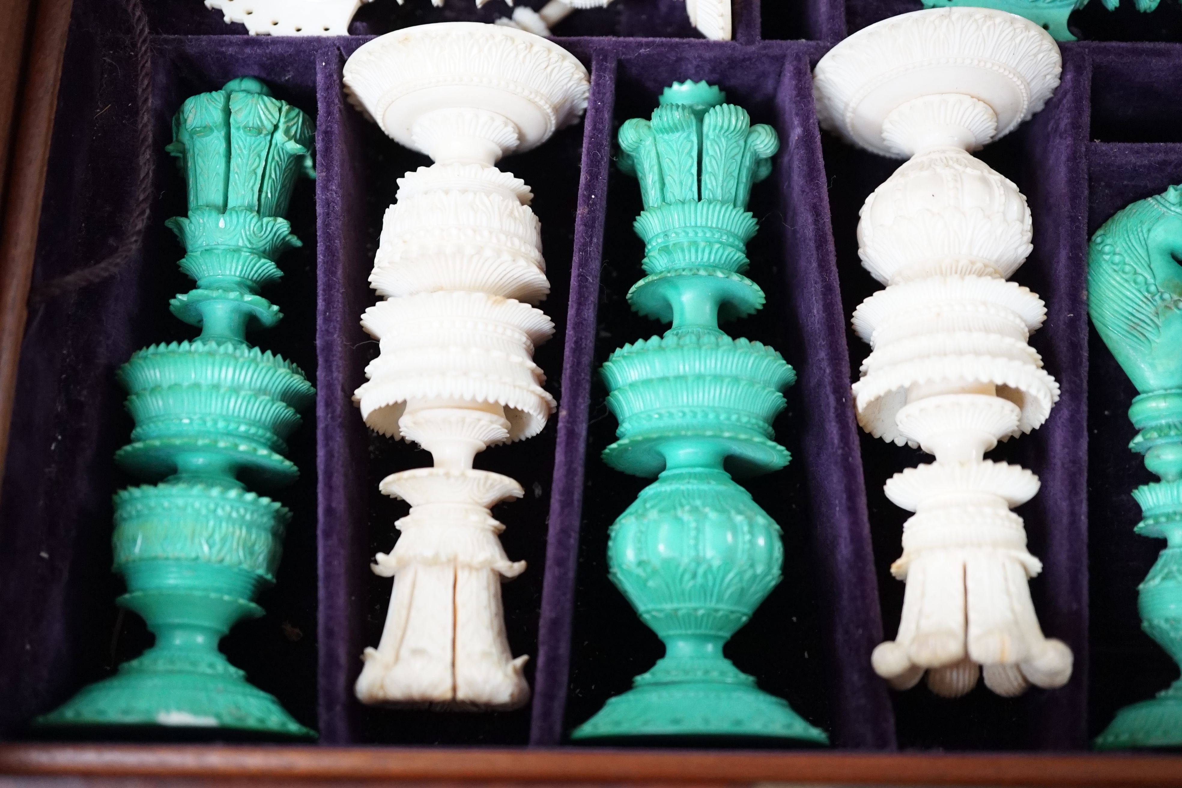A boxed 19th century Burmese pattern ivory chess set, one pawn restored, king height 11cm